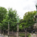 The Petit Sablon Garden is enclosed by a wrought iron fence decorated with statues